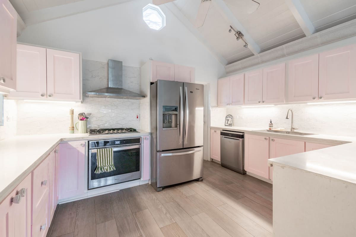 Kitchen with softly painted pink cabinetry